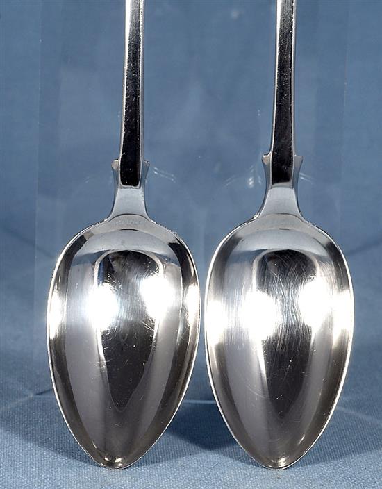 A pair of William IV silver fiddle pattern serving spoons and a similar Victorian pair, Length 237mm, weight 4.9oz/153grms
